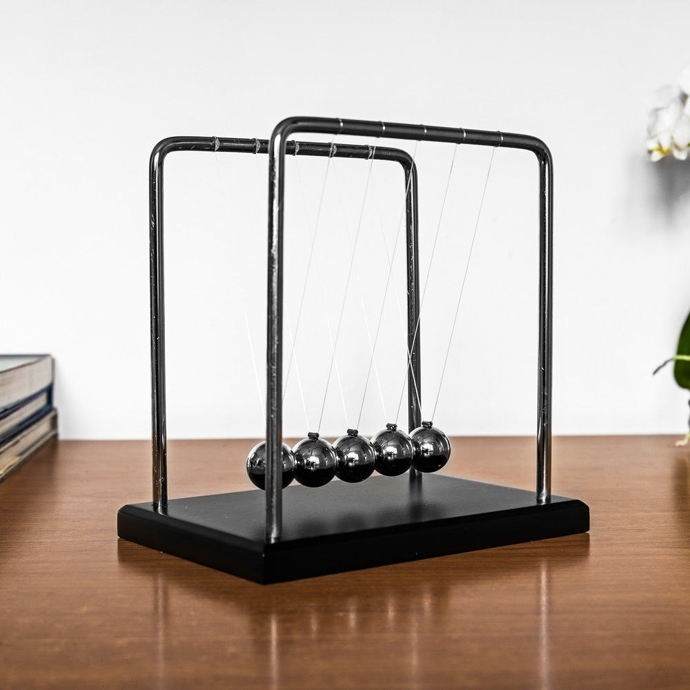 The Source Newtons Cradle